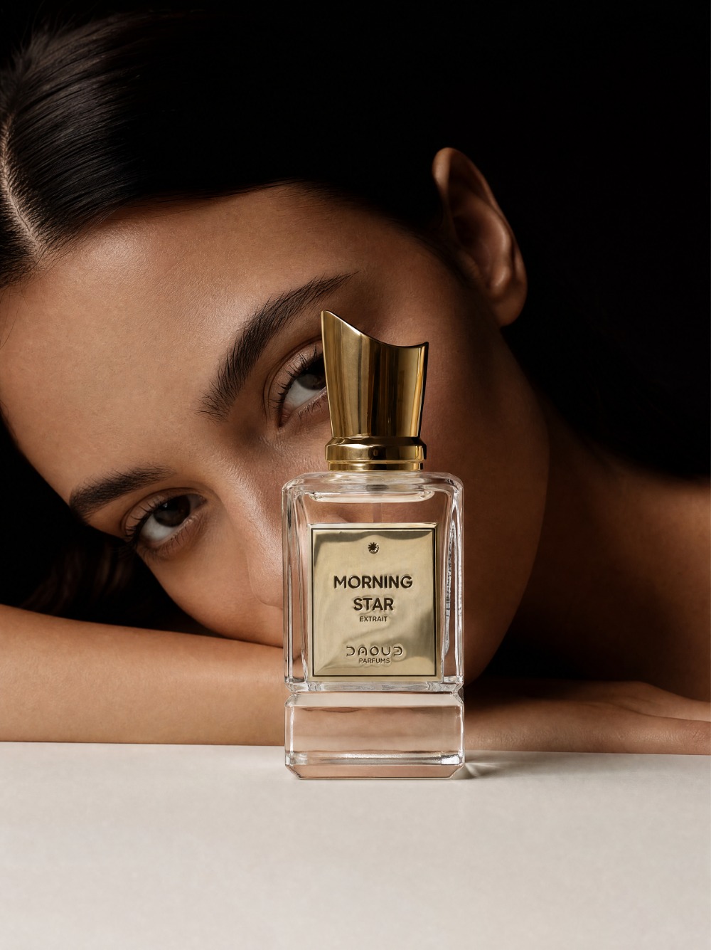 DAOUD Morning Star campaign poster with a model and the bottle in close-up